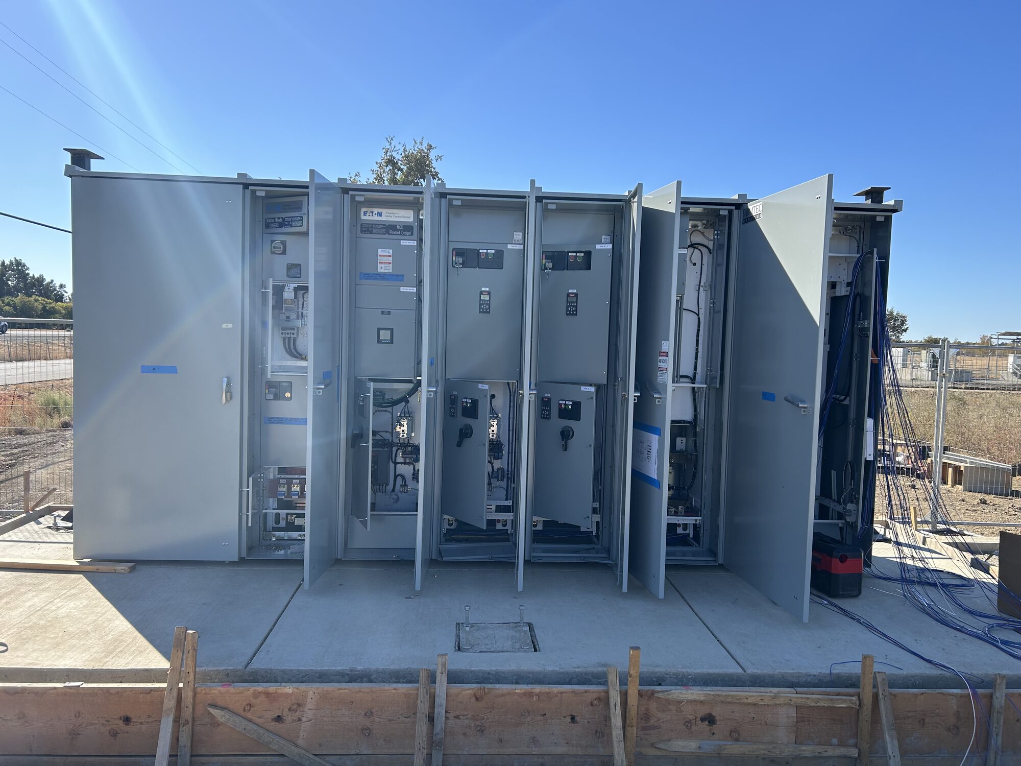 Outdoor switchgear and motor-control lineup wired by Fusion Electric at a plant